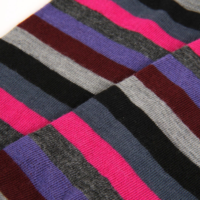 Close-up of multicolored striped fabric with pink, purple, gray, and black.