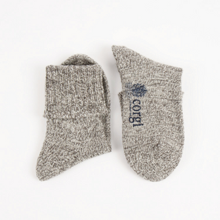 Pair of gray socks with 'corgi' text on a white background