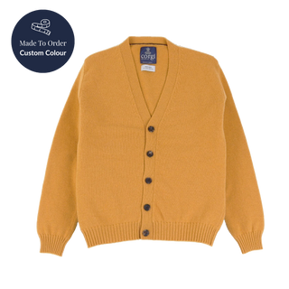 Mustard yellow cardigan with black buttons on a white background, featuring a 'Made to Order Custom Colour' label.