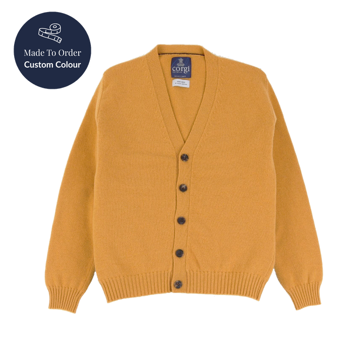 Mustard yellow cardigan with black buttons on a white background, featuring a 'Made to Order Custom Colour' label.