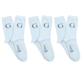 Set of white socks with 'G' letter on a white background