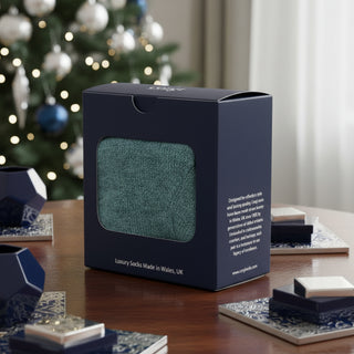 Navy blue packaging box with a window displaying green socks, featuring Corgi Socks branding.