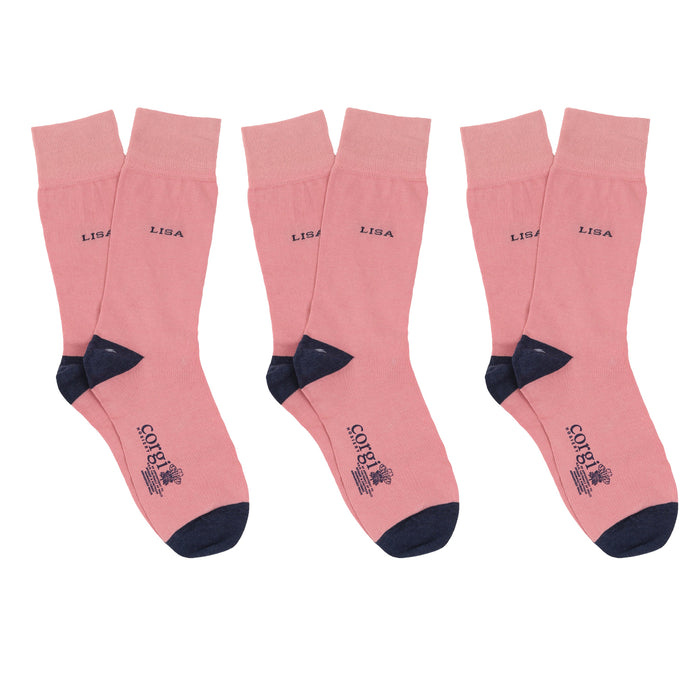 Set of pink socks with 'LISA' name on a white background