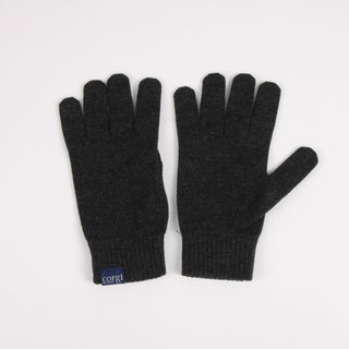 Pair of black gloves with a visible brand logo on a light gray background