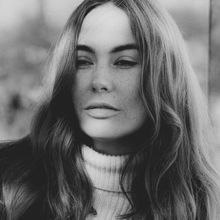 Black and white portrait of a woman with long hair
