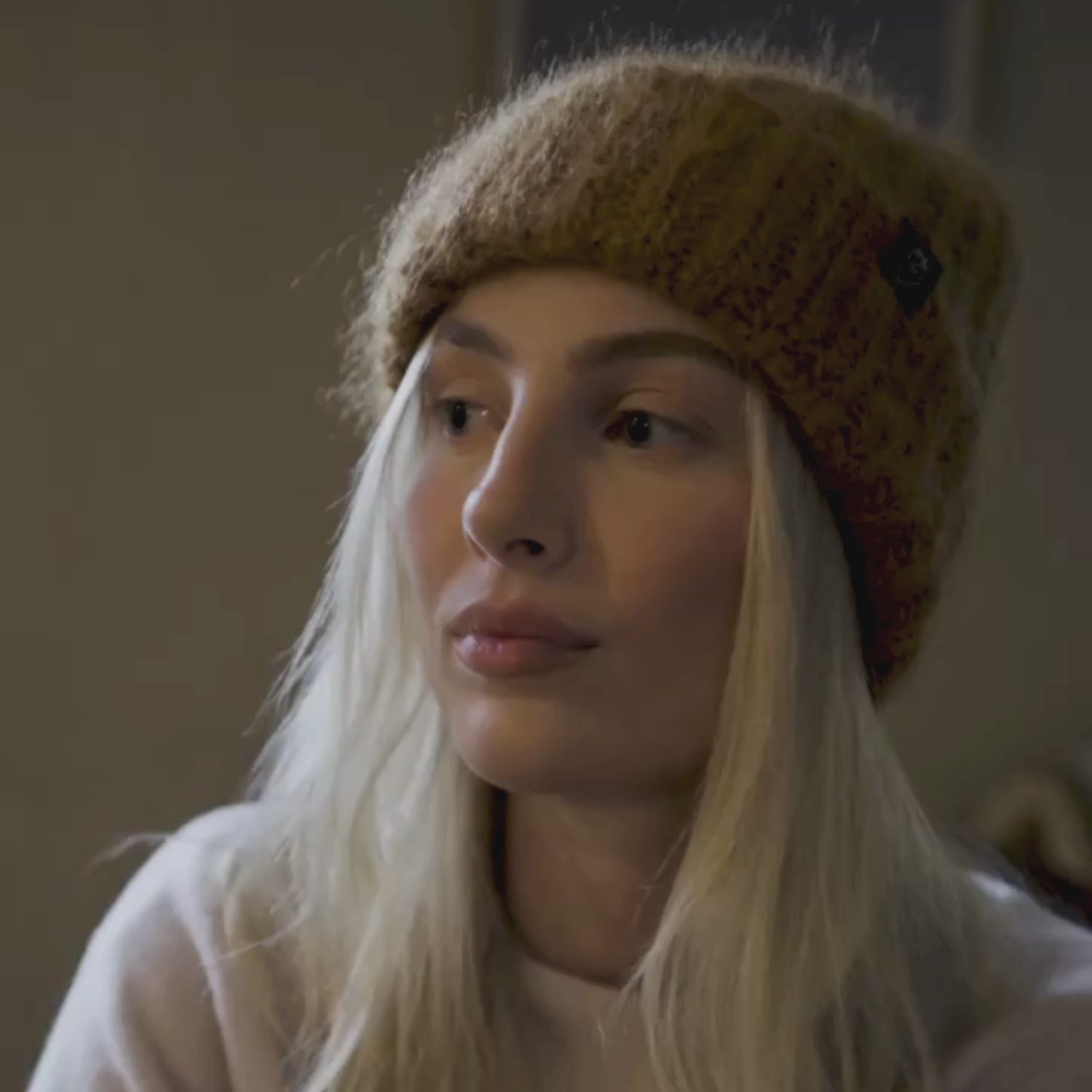 video of a person wearing a mohair beanie hat