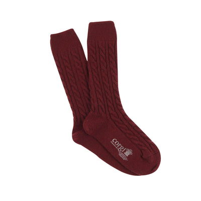 A pair of wine cashmere socks with a cable knit pattern, displayed against a white background.