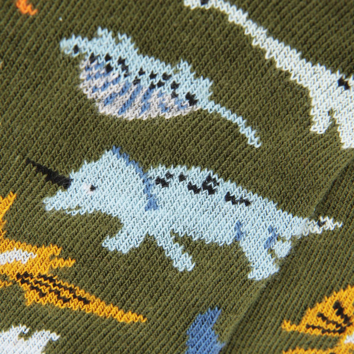 Knitted fabric with dinosaur pattern on a green background