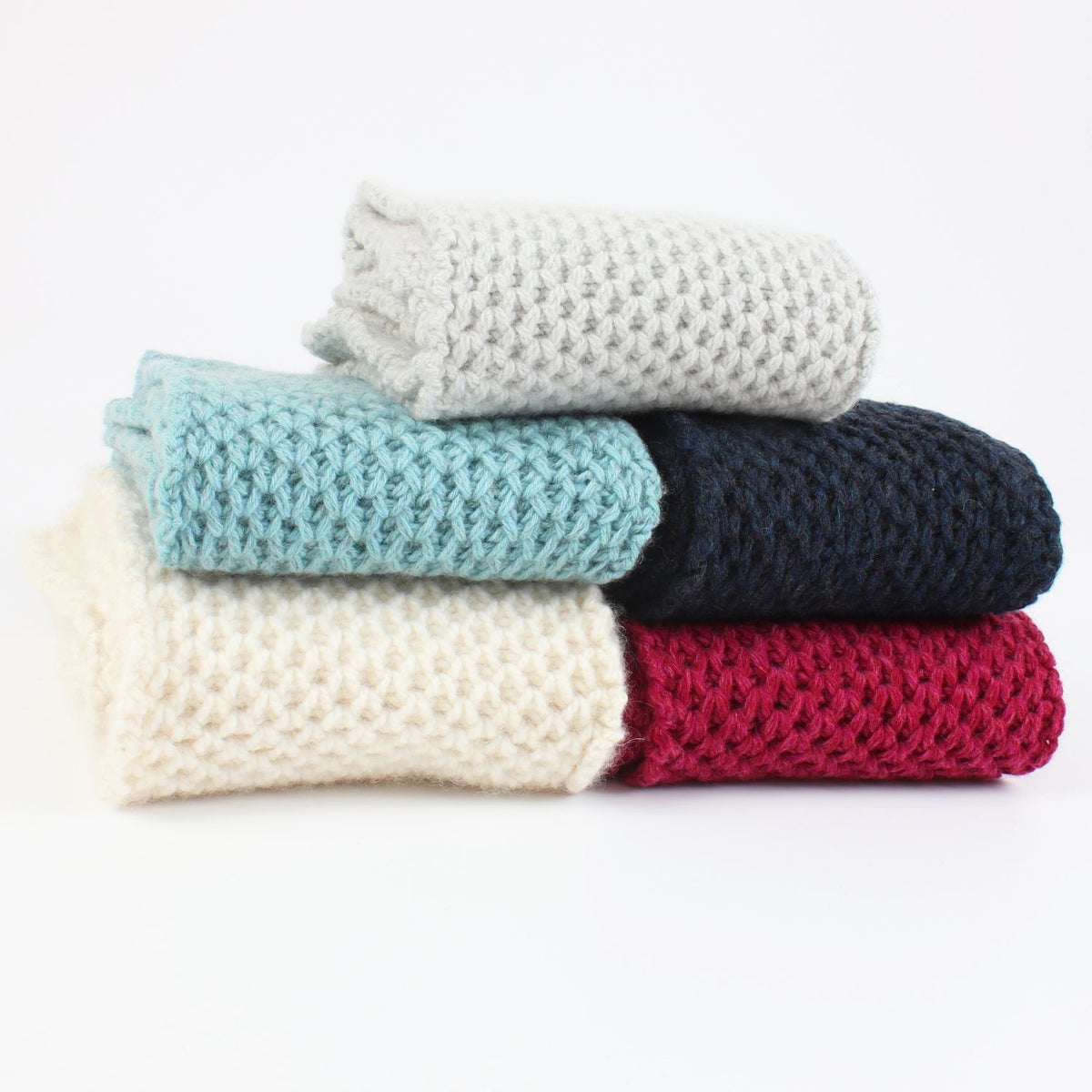 honeycomb scarves stacked on a white background