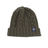 A green men's wool beanie with a cable knit pattern and a ribbed turn-up hem.