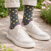 man wearing polka dot cotton socks in charcoal on a garden path