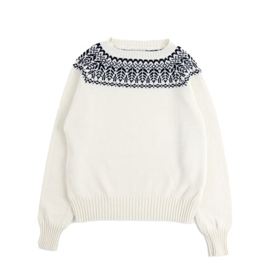 White sweater with navy patterned collar on a white background