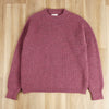 dusty pink crew pullover on a wooden surface