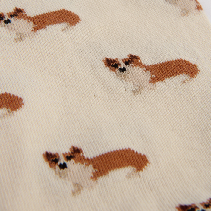 Pattern of small dogs on a beige background
