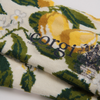 Corgi brand fabric with lemons and flowers on a white background