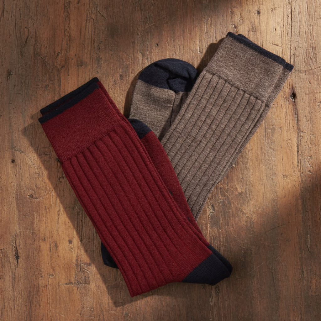 Two pairs of ribbed socks in red and brown on a white background


