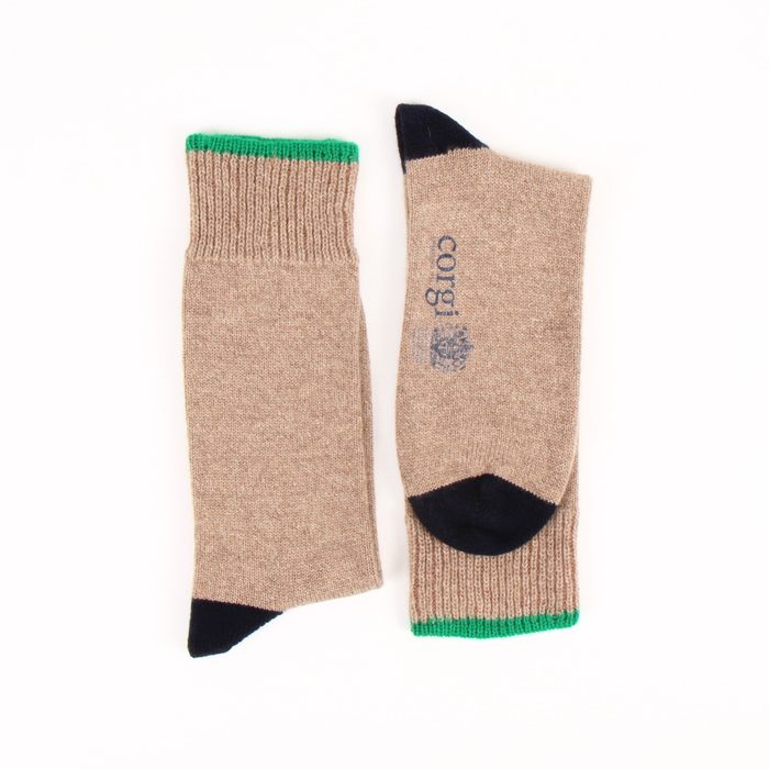 Pair of beige socks with navy and green accents on a white background