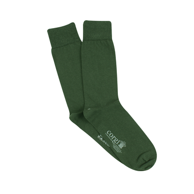 A pair of green cashmere blend socks displayed in a folded manner against a white background.