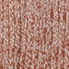 Close-up of a knitted fabric with a brown and white pattern