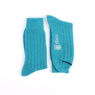 Pair of teal socks with a logo on a white background