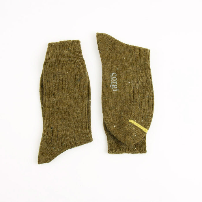 Pair of green socks with a brand logo on a white background