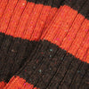 Close-up of brown and orange striped fabric texture