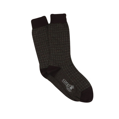 A pair of men's formal houndstooth merino wool socks in charcoal showing the pattern and texture.