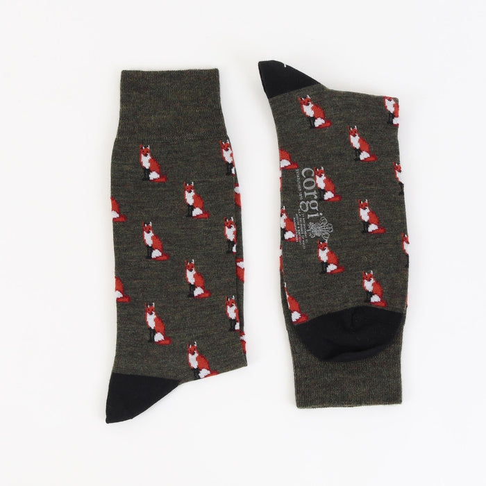 Green merino wool socks with sitting fox motif pattern