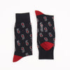 Navy socks with red accents and paisley pattern on a white background