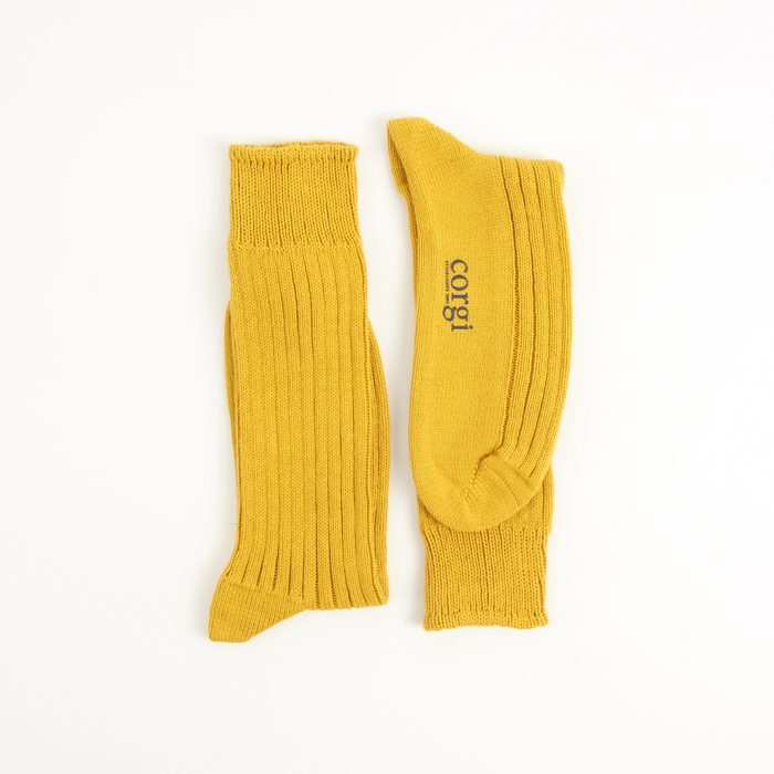 yellow pure cotton boots socks laid flat on a white background