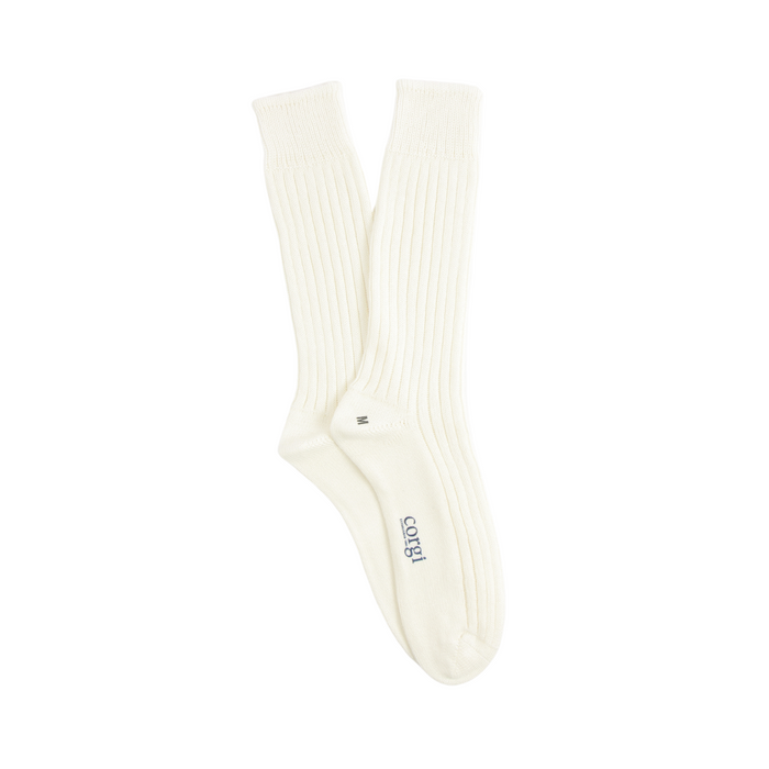 white pure cotton boots socks laid flat on a white background