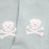 Light aqua socks with white skull and crossbones design.