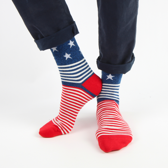 person wearing USA flag socks with legs crossed