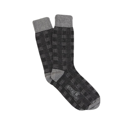 A pair of men's formal woven check cotton socks in black and white, 