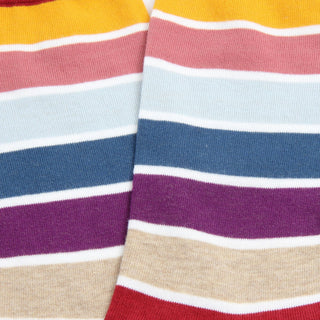 Close-up of colorful striped fabric with a mix of red, yellow, blue, purple, and beige.