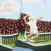 A pair of men's tennis socks with a pattern depicting a tennis player and crowd scene on a light background, with dark green at the cuffs.