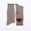 Pair of brown marl socks with a visible brand logo on a white background