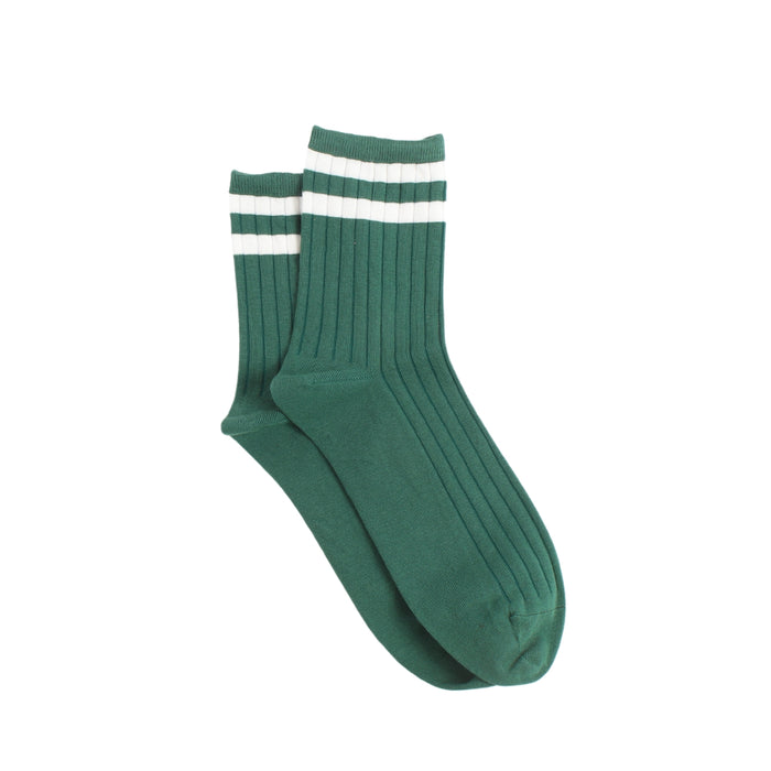 Green sock with white stripes on a white background