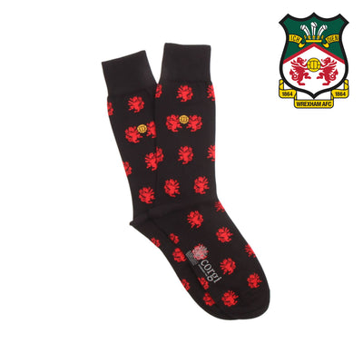 Black socks with red patterns and a logo on a white background