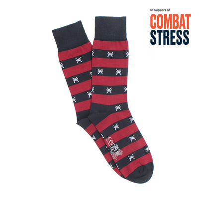 Red and navy striped socks with star pattern on a white background, supporting Combat Stress.