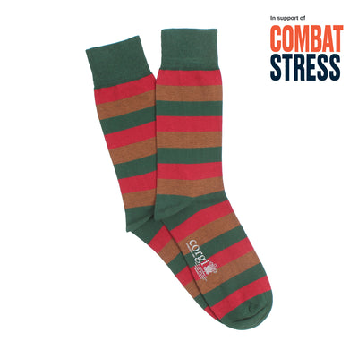 Green and red striped socks with 'Combat Stress' text on a white background