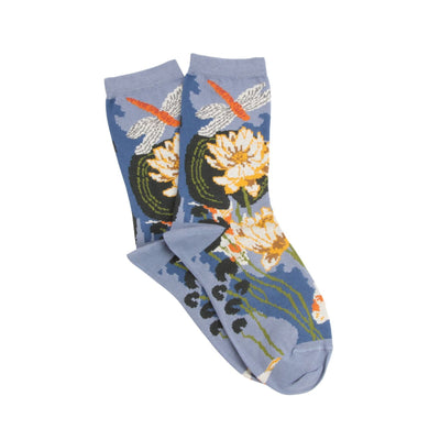 Pair of socks with floral and dragonfly design on a light blue background