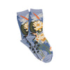 Pair of socks with floral and dragonfly design on a light blue background