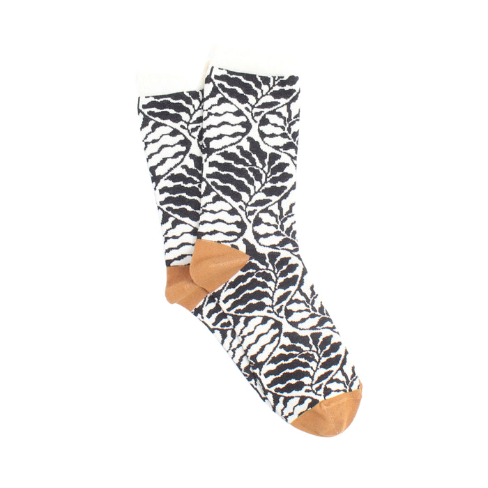 Modern floral print sock with brown toes and heels on a white background