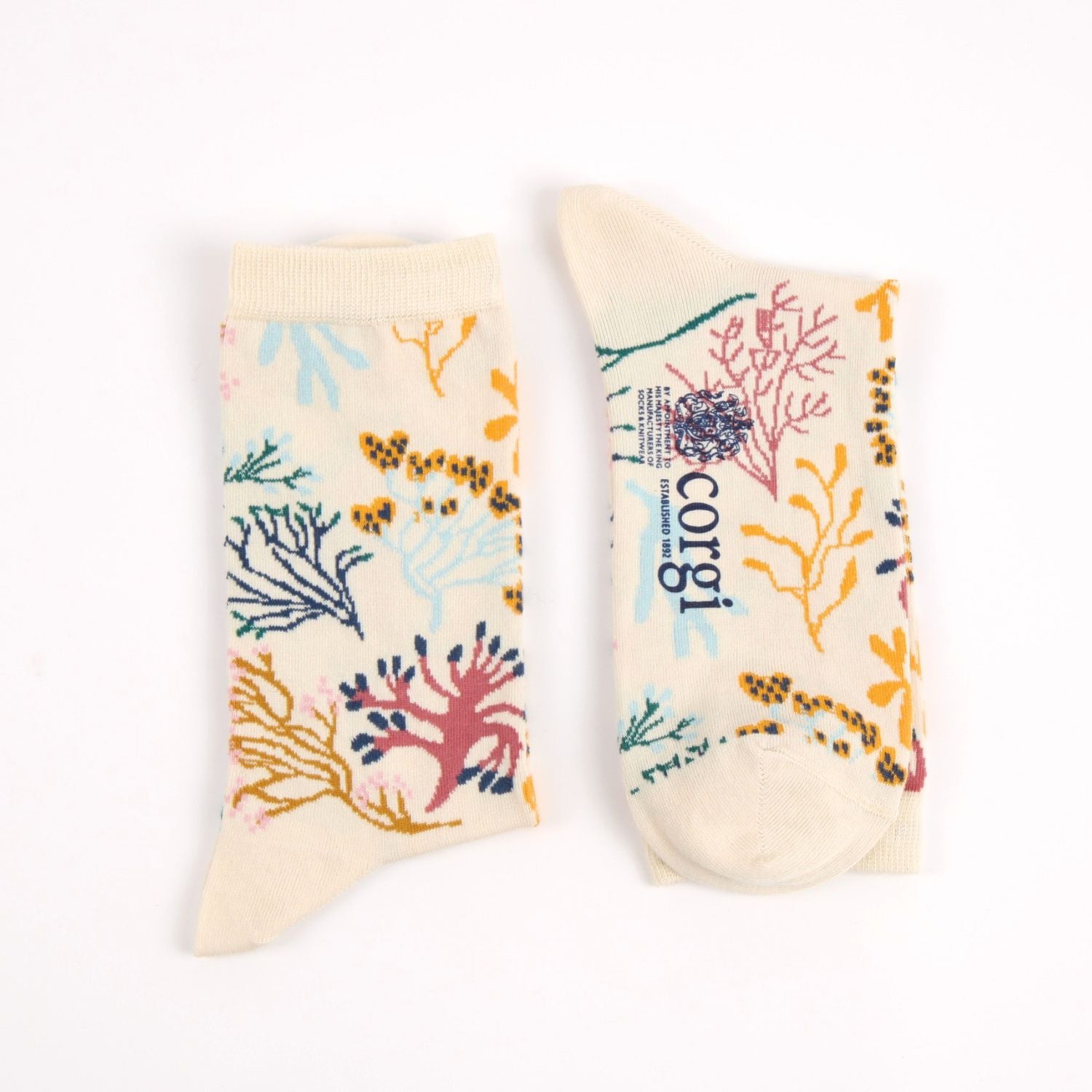 Pair of socks with colorful coral design on a white background