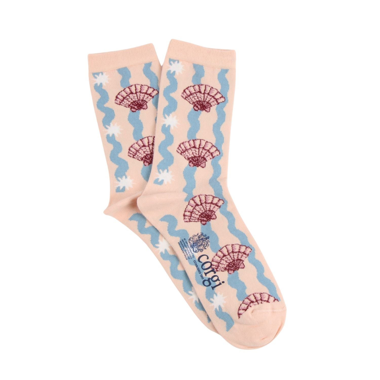 Pair of socks with shell and wave pattern on a beige background
