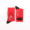Red socks with a cartoon dragon design and 'Corgi' branding on a white background
