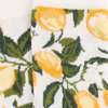 Socks with lemon and leaf pattern on a white background