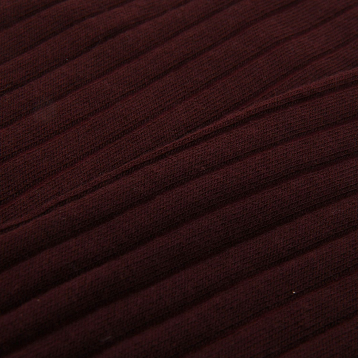 Close-up of wine colour ribbed fabric texture