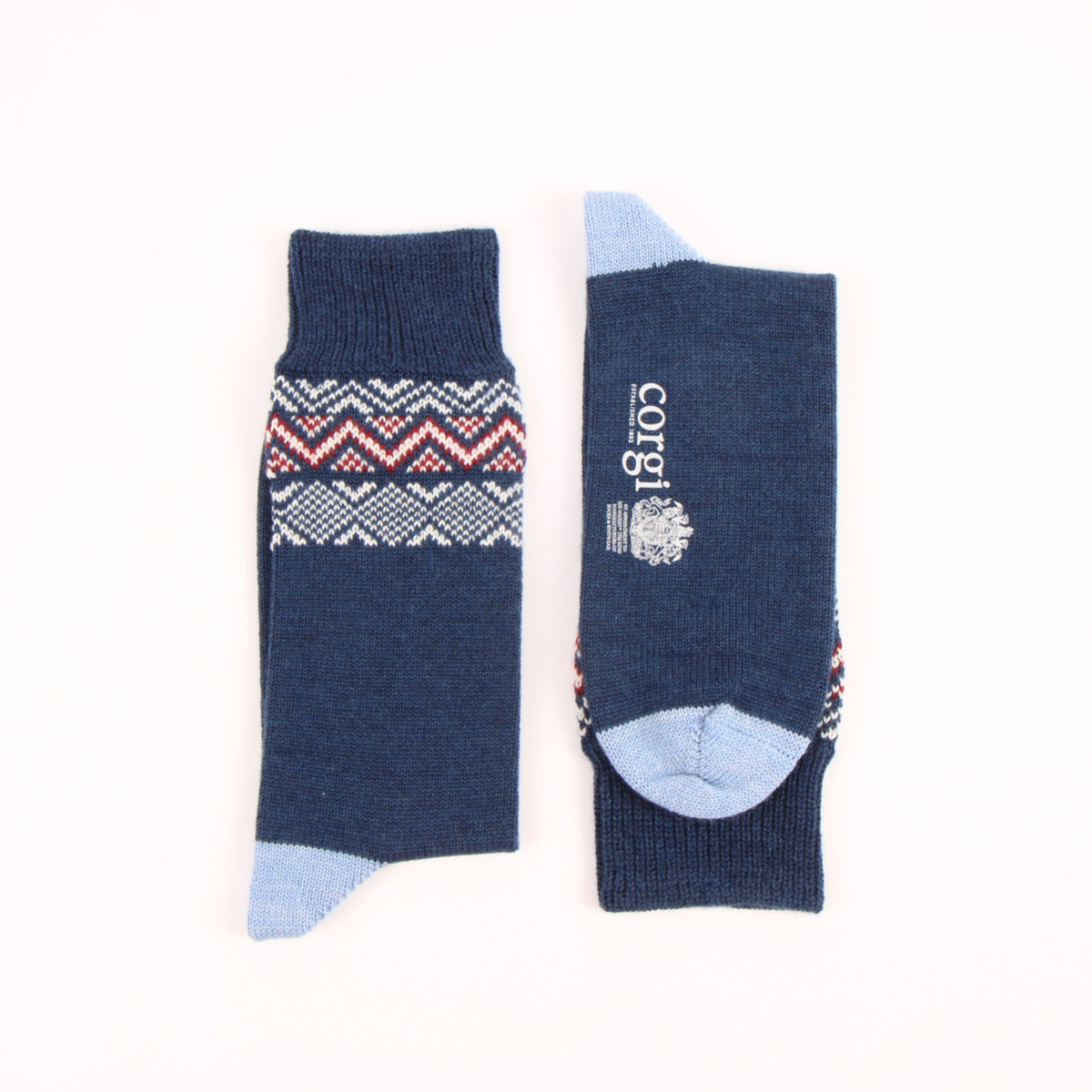 A pair of navy blue crew socks shown flat against a white background, displaying both the front patterned cuff and the back with the brand name 'cotgrès' printed in white.